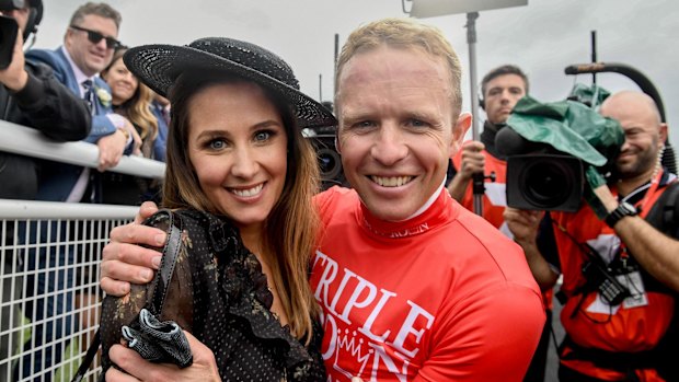 Moment to savour: Kerrin McEvoy with wife Cathy after a famous victory.