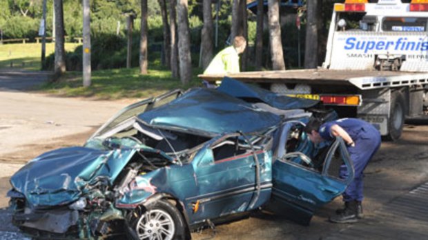 Wreckage ... witnesses say the car was shunted off Nowra Bridge.