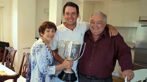 Champion ... Popovic with his parents.