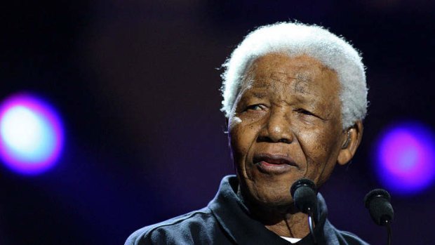 Nelson Mandela at the 2005 Live8 Concert to fight poverty in Johannesburg. He is in a "critical but stable condition" in hospital.