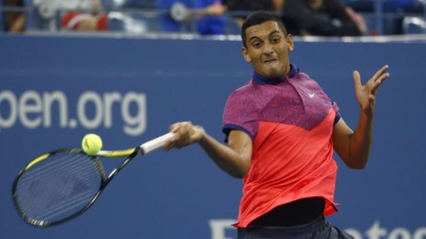 Nick Kyrgios of Australia returns a shot to Tommy Robredo of Spain in their US Open third round match.