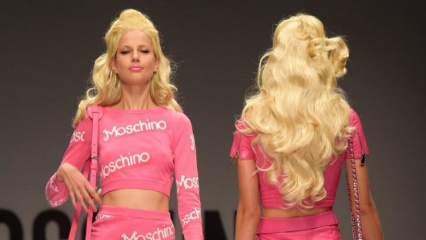 Models walk for Moschino at Milan Fashion Week, 2014.