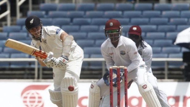 New Zealand's Kane Williamson drives, watched by West Indies wicketkeeper Denesh Ramdin (centre) and Chris Gayle.
