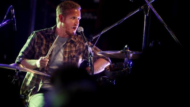 Tim Hart in his role as Boy and Bear drummer.