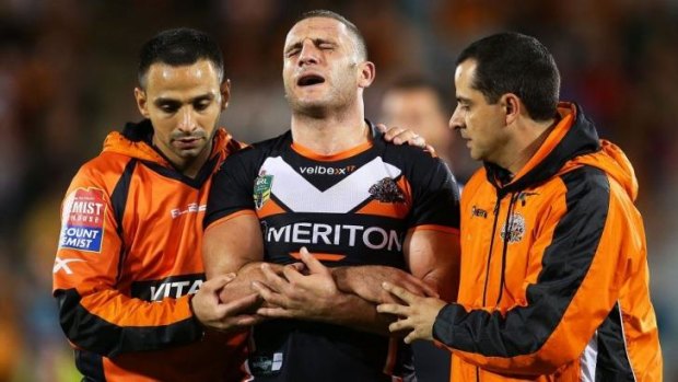 Wounded Tiger: Robbie Farah began a tough week for the Tigers with a serious elbow injury on Saturday night.
