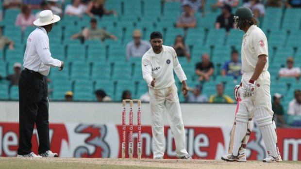 Harbhajan Singh (centre) asks Andrew Symonds to move as umpire Steve Bucknor looks on during the second Test at the SCG in 2008.