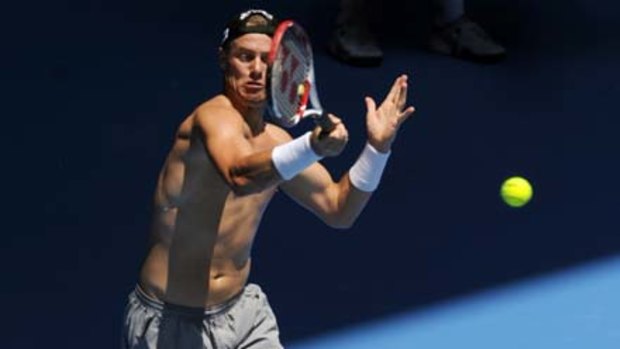 Lleyton Hewitt gives it his all in practice at Melbourne Park yesterday.