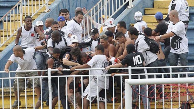 Vasco da Gama soccer fans beat up an Atletico Paranaense fan.