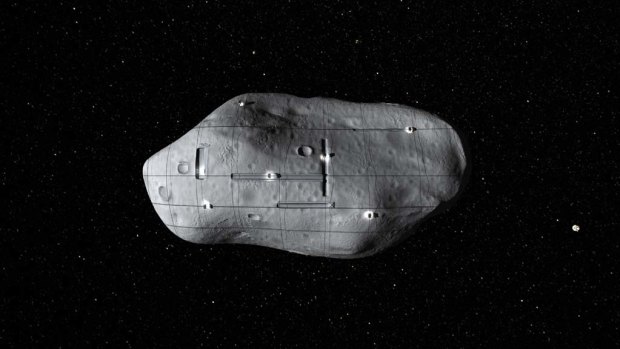 A conceptual rendering of several small robotic spacecraft mining a near-Earth asteroid.