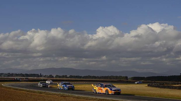 Driving to the top: Will Davison leads teammate Mark Winterbottom to victory in Tasmania yesterday to continue the Ford team's early season domination in the V8 Supercars Championship.