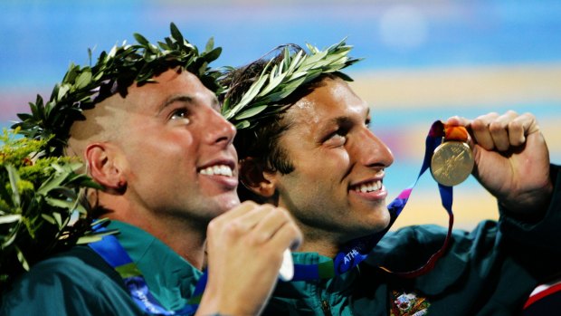 Grant Hackett and Ian Thorpe celebrate medals at the Athens Olympics in 2004.