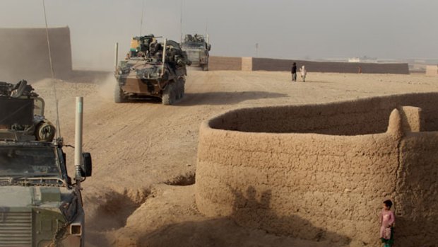 Uphill battle: Australian soldiers travelling in convoy near Australia's main Afghan base of Tarin Kowt in Oruzgan province.