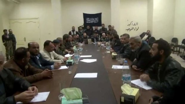An image grab taken from a video uploaded on YouTube last November allegedly shows Syrian Islamist rebel groups delivering a speech rejecting the newly formed opposition bloc.