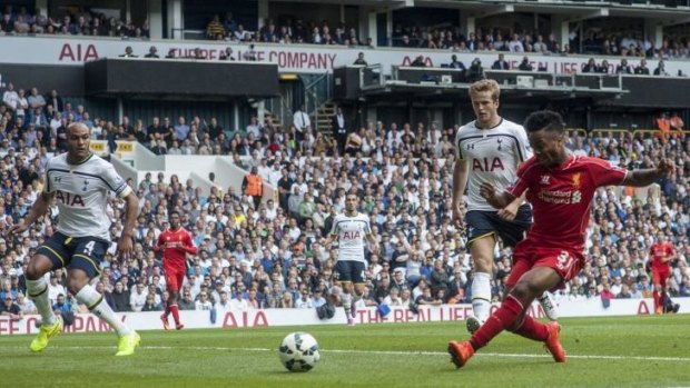 Liverpool's Raheem Sterling scores his side's first goal against Tottenham Hotspur on Sunday.