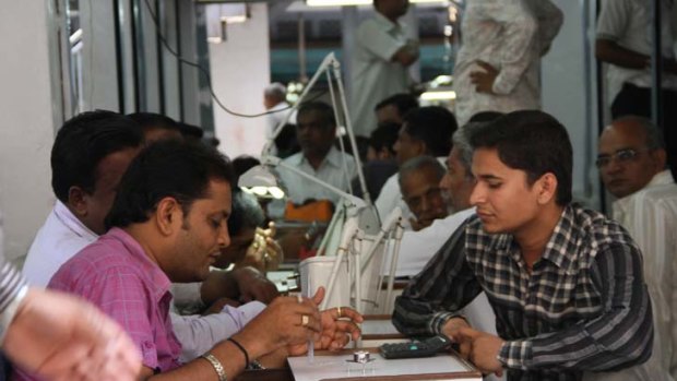Diamond traders do business on the streets of Surat.
