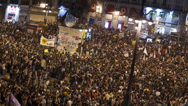 Thousands of demonstrators gather to protest at Puerta del Sol square in Madrid.