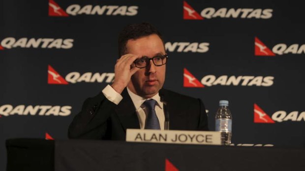 Alan Joyce describes the cuts as "tough decisions" during the press conference.