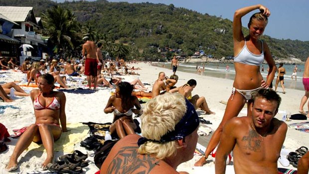 Look at what the crazy backpackers do ... Chinese tourists find Thailand's beach parties a cultural curio.