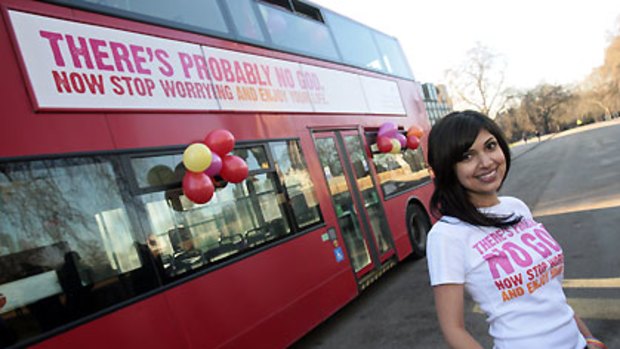 Comedy writer Ariane Sherine with one of the buses advertising that there's 'probably no God'.