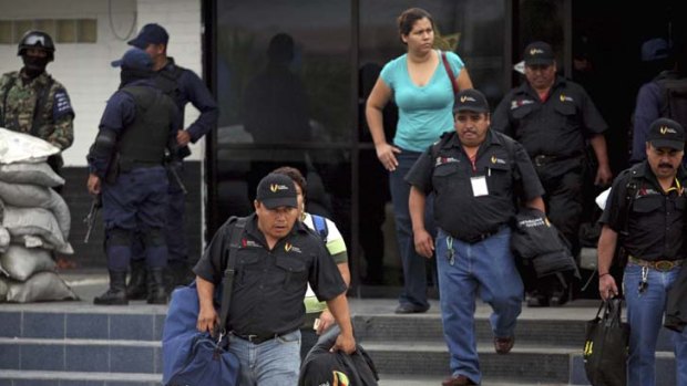 Municipal policemen leave a police station in Veracruz.