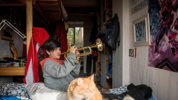 Ten-year-old Sidney Bertram playing his Dad's trumpet - one of three instruments he can play. 
