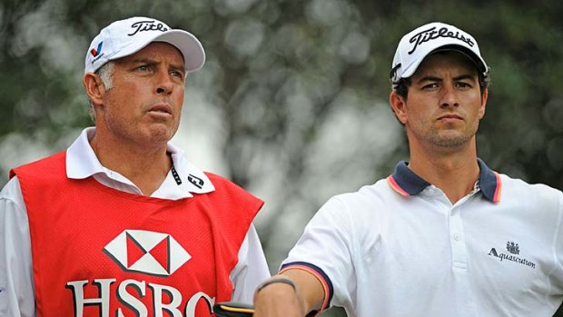 Sorry: Steve Williams (left, with Adam Scott) apologised after a comment about Tiger Woods at a dinner during the HSBC Champions tournament in Shanghai.