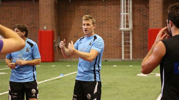 Nathan Buckley holds a training session for the team in Utah.
