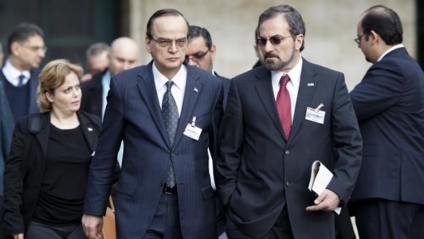 Syrian opposition chief negotiator Hadi Bahra (centre left) and Louay Safi (centre right), spokesperson for the Syrian National Coalition, leave peace talks.