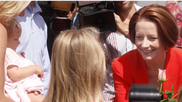 Taking a moment ... Prime Minister Julia Gillard visits Cessnock, in the Hunter Valley.