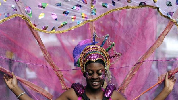A performer takes part in the Notting Hill Carnival children's day in London.
