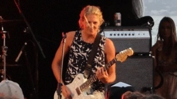 Surf star Stephanie Gilmore on guitar at the Snapper Rocks concert with Foo Fighters Taylor Hawkins and Chris Shiflett, and Wolfmother's Andrew Stockdale.