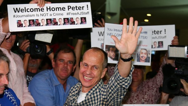 Peter Greste is greeted by jubilant supporters in Brisbane on Thursday morning. 