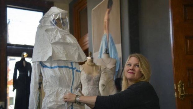 Life-saving fashion ... Jill Andrews of Jill Andrews Gowns in Baltimore works on a prototype of a personal protective equipment (PPE) worn by healthcare workers treating Ebola. 