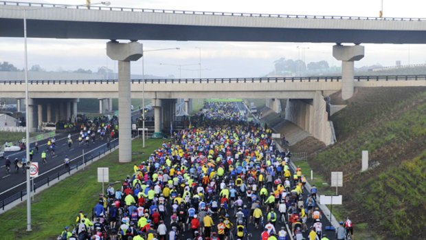 Traffic jam: An estimated 100,000 people walked, ran or cycled along the EastLink freeway at an open day yesterday.
