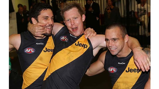 After the roar: Tigers (from left) Troy Chaplin, Jack Riewoldt and Jake King enjoy the win against Fremantle on Sunday.