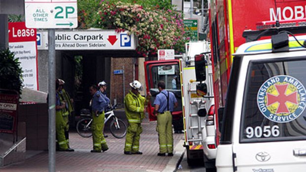 Firefighters arrive at Adelaide Street after a suspicious package was delivered to a building housing the Department of Immigration and Citizenship offices.