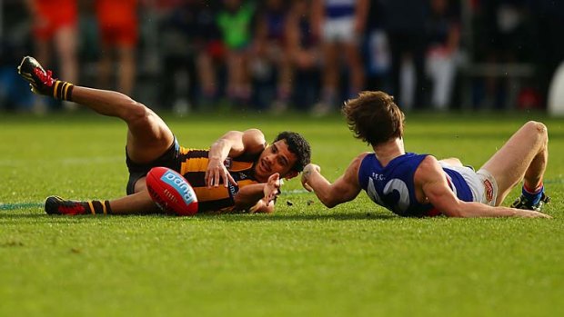 Flat out: Cyril Rioli and Liam Picken.