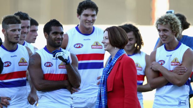 PM Julia Gillard congratulates the Bulldogs after their match against Greater Western Sydney at Manuka Oval on April 28.