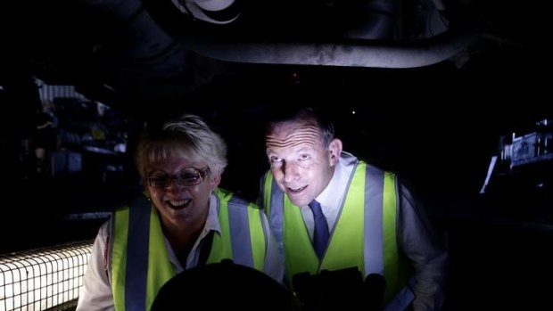 Opposition Leader Tony Abbott during a visit to a transport company in Rockhampton, Queensland, on Saturday.
