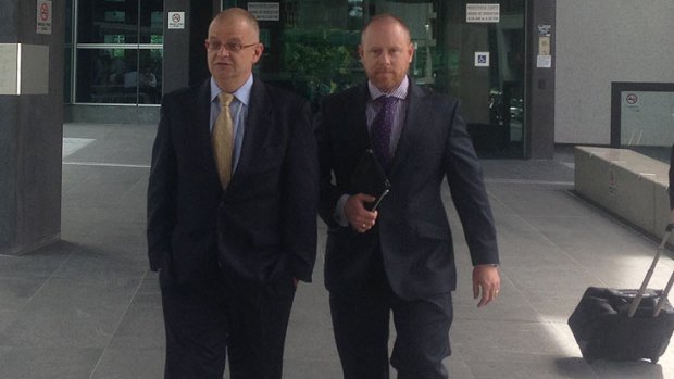 Brett Peter Cowan's lawyers Michael Bosscher and Tim Meehan leave court.