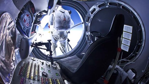 Felix Baumgartner steps out of the capsule at an altitude of 29 kilometres.