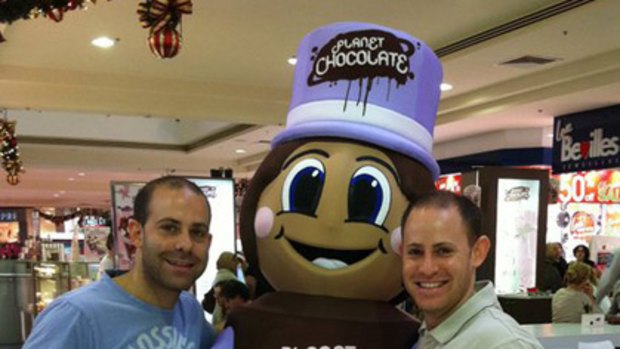 Brothers Darren (left) and Greg Factor with mascot 'Mr Choco'.