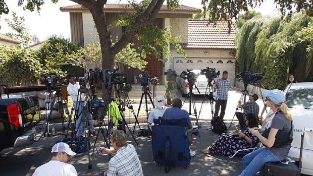 In hiding &#8230; reporters gather outside Nakoula's house.