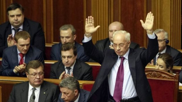 Ukrainian Prime Minister Mykola Azarov gestures during a parliamentary debate in the capital Kiev.