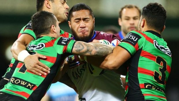 Out: Jorge Taufua is wrapped up by the Souths defence in round 22.