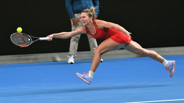 Simona Halep stretches herself against Angelique Kerber on Rod Laver arena.