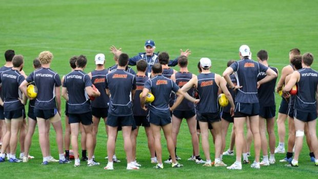 Centre of attention: Michael Malthouse addresses the Blues on the first day of pre-season training.