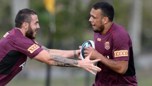 In the clear: Maroons winger Will Chambers trains alongside Darius Boyd.