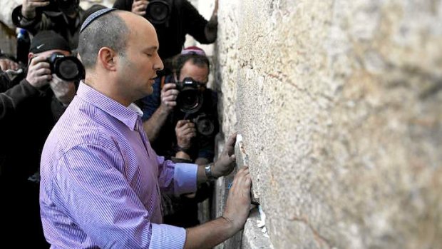 Challenger: Naftali Bennett, head of the Jewish Home party, visits  the Western Wall in Jerusalem on Monday.