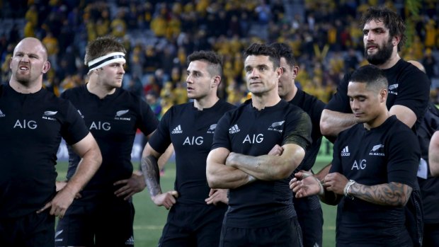 New Zealand's All Blacks react after their Bledisloe Cup rugby match loss to the Wallabies in Sydney. 